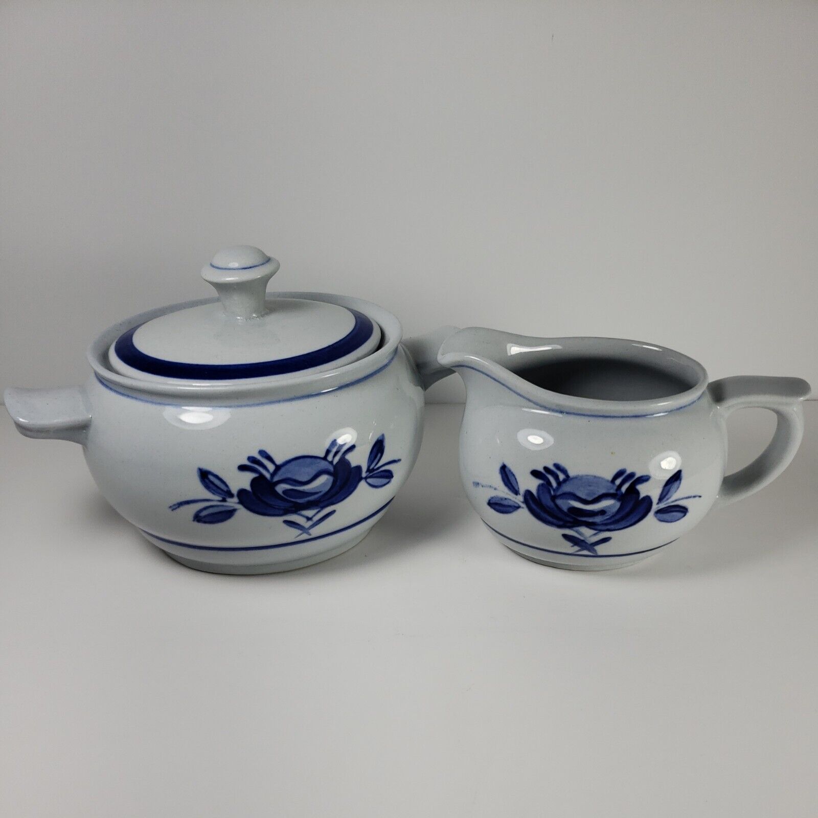 Read more about the article ARABIA Blue Rose Oval Sugar Bowl w/Handles and Creamer Flower Rings Hand Painted