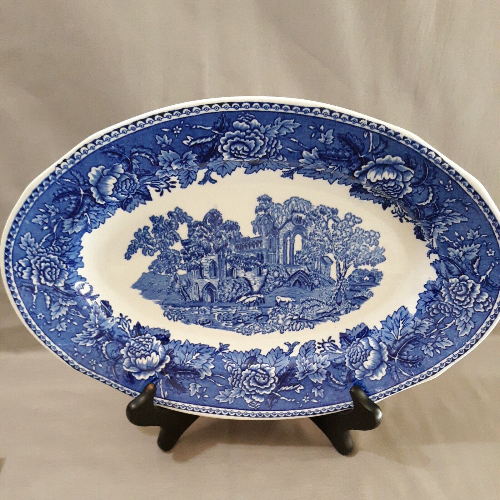 Read more about the article Vintage Arabia Finland Landscape Blue 12 7/8″ Oval Platter Florals Sheep Ruins