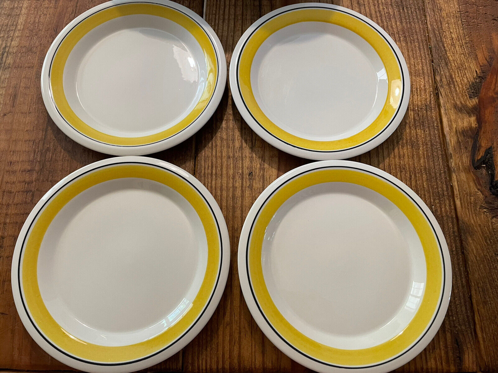 Read more about the article Set (4) Arabia Findland Faenza Yellow Black Stripe Bread Plate 6.5” Saucer