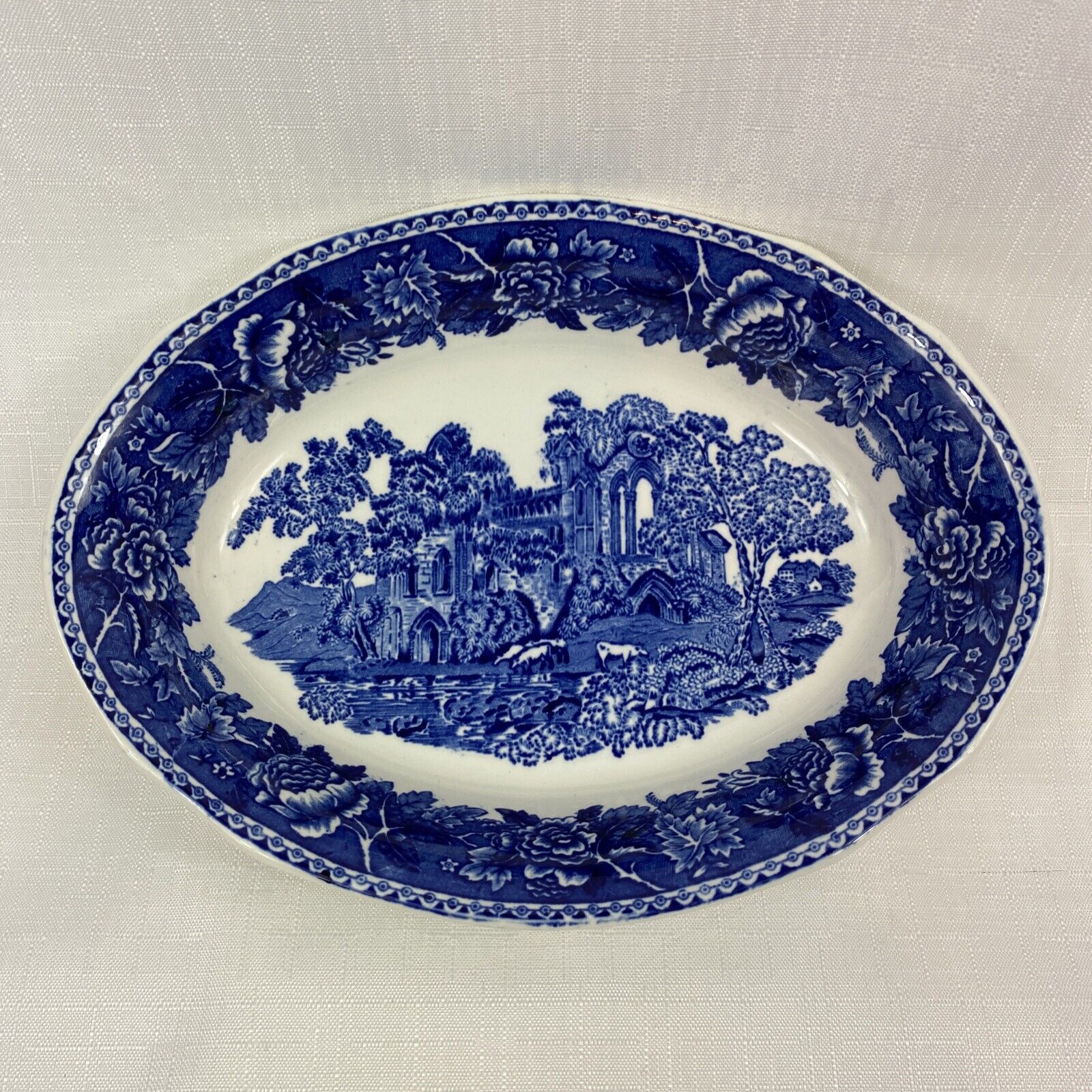 Read more about the article ARABIA FINLAND Blue and white landscape oval serving dish 10”x 7” Marked A.S 1