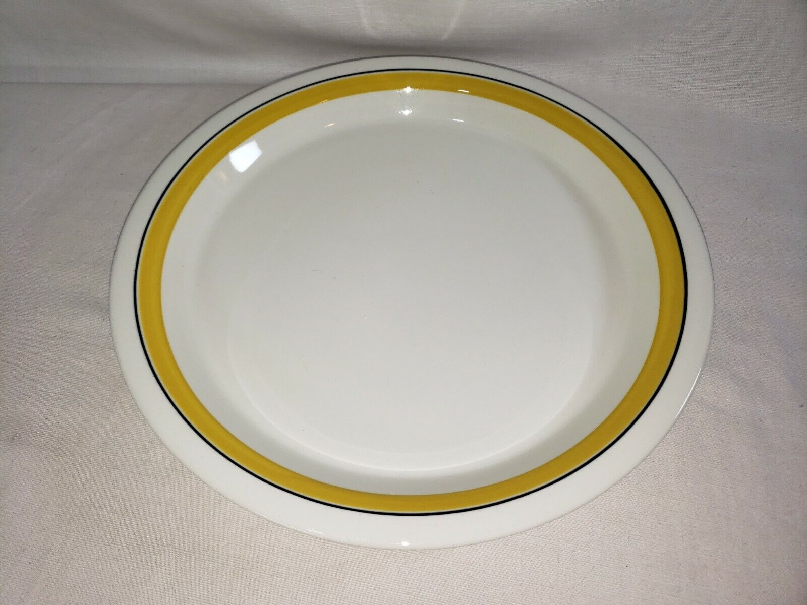 Read more about the article Arabia Finland Faenza Yellow with Black Stripe 12” Chop Plate / Platter – G/VG