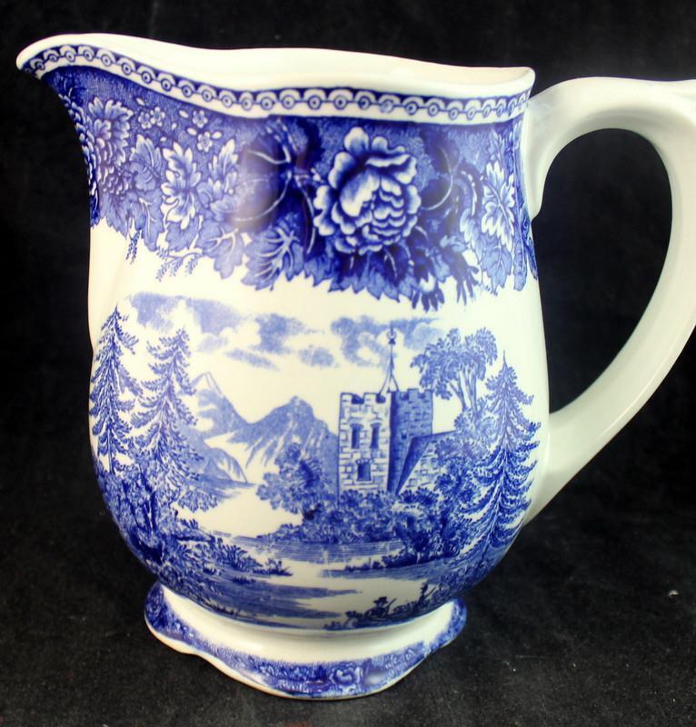 Read more about the article Arabia Landscape Blue 32 Ounce Pitcher SMALL NICK ON FOOT