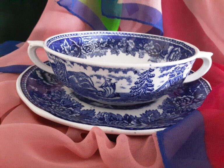 Read more about the article Finland Arabia Blue and White Cream Soup Cup and Saucer Blue Landscape. Antique.